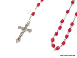 VINTAGE ROSARY WITH RED PLASTIC BEADS; ON A SILVER COLORED STRAND MEASURING 29 IN LONG, WITH A