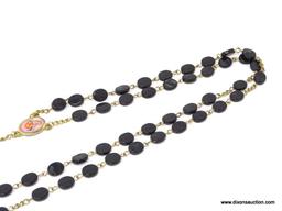 VINTAGE ROSARY WITH BLACK BEADS; 5 SETS OF 10 FLAT BLACK OVAL-SHAPED BEADS, ON A GOLD COLORED STRAND