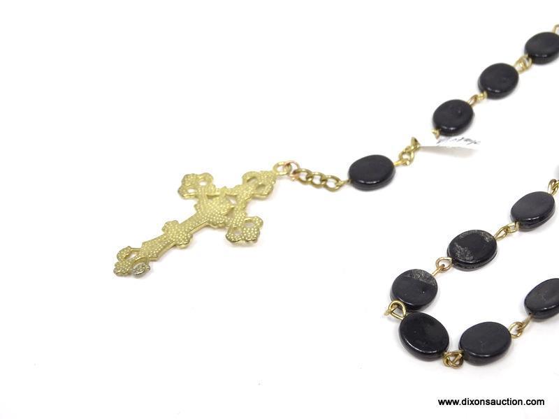 VINTAGE ROSARY WITH BLACK BEADS; 5 SETS OF 10 FLAT BLACK OVAL-SHAPED BEADS, ON A GOLD COLORED STRAND