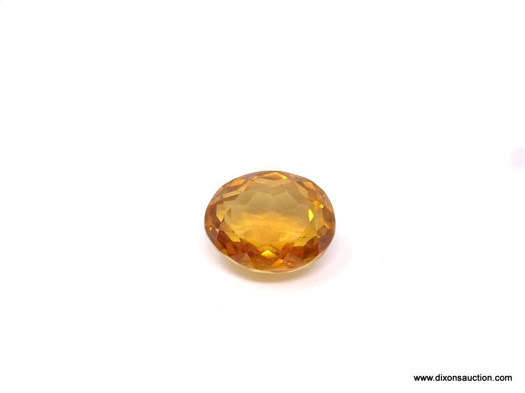 LOOSE GEMSTONE; 15.63 CT OVAL CUT CITRINE. 17 X 14 X 10