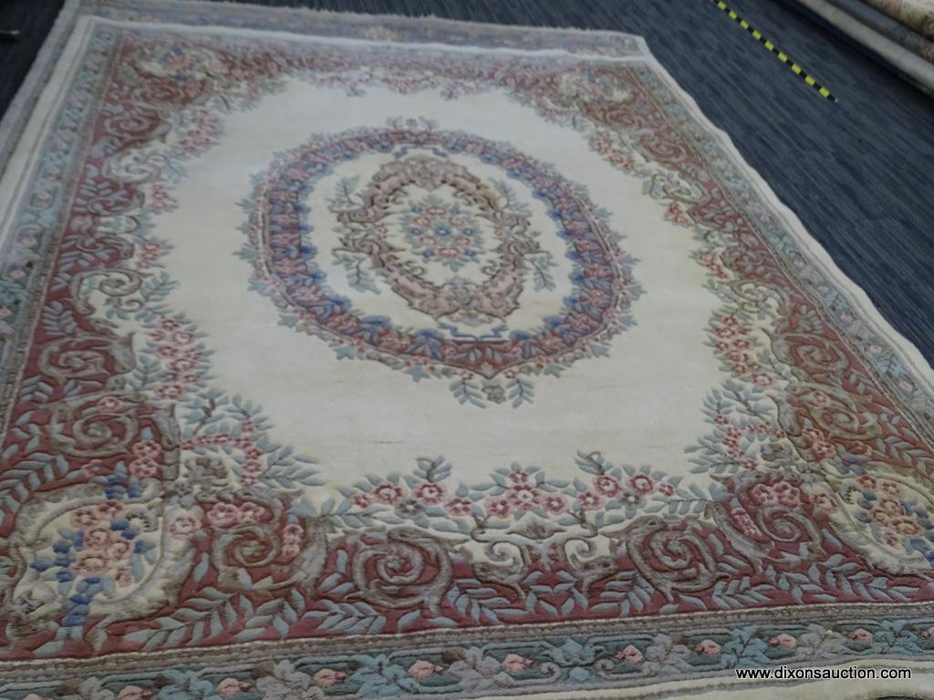 HAND WOVEN AUBUSSON STYLE RUG MADE IN INDIA. IS IN GOOD CONDITION. IN IVORY, PINKS, BLUES, AND