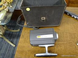 BELL AND HOWELL SUPER EIGHT CAMERA AND CASE; CIRCA 1960'S HANDHELD MODEL, COMES WITH FLIP TOP CASE