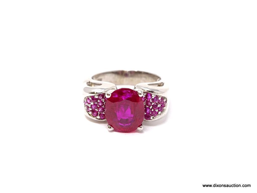 PIGEON RED RUBY OVAL RING; SIZE 7.75, .925, APPROX 6.20 CT, RED MAIN STONE FLANKED BY CLUSTERS OF 20