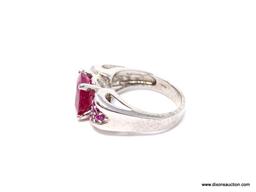 PIGEON RED RUBY OVAL RING; SIZE 7.75, .925, APPROX 6.20 CT, RED MAIN STONE FLANKED BY CLUSTERS OF 20