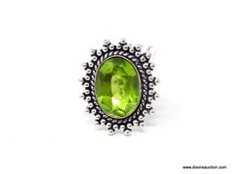 GERMAN SILVER & PERIDOT GEMSTONE RING. APPROX. RING SIZE 8.