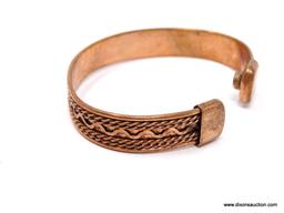 VINTAGE COPPER SOUTHWESTERN DESIGN MAGNETIC THERAPY CUFF BRACELET. APPROX. 1/2" WIDE. MEASURES ABOUT