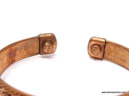 VINTAGE COPPER SOUTHWESTERN DESIGN MAGNETIC THERAPY CUFF BRACELET. APPROX. 1/2" WIDE. MEASURES ABOUT