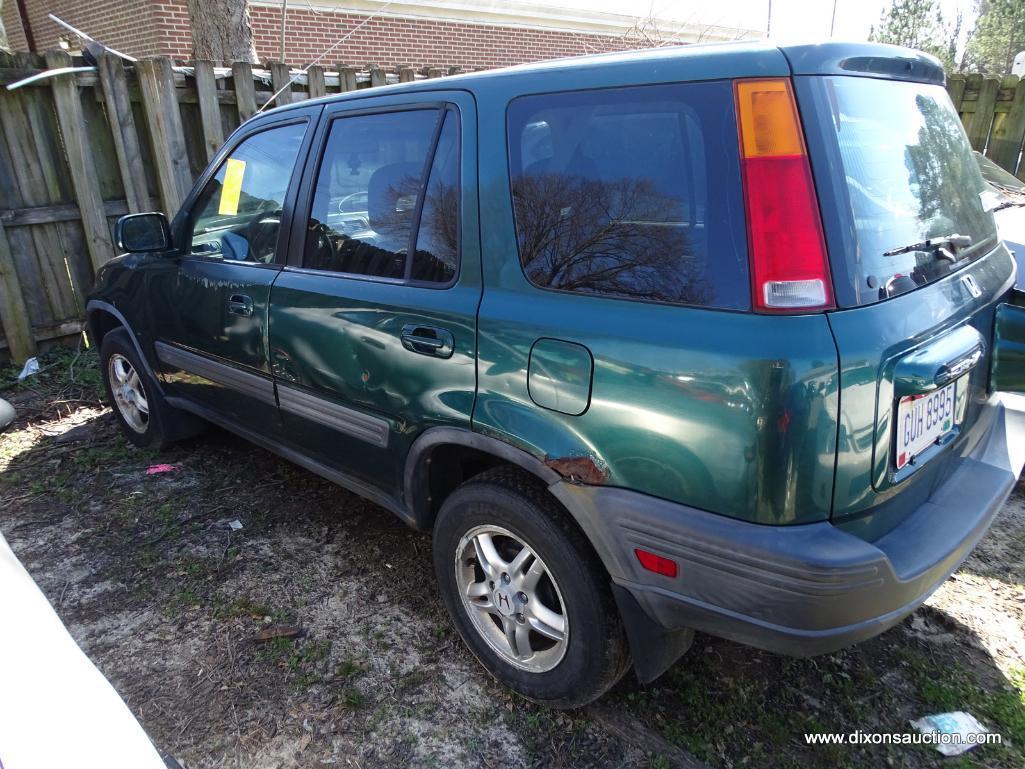 GREEN HONDA CR-V; VIN JHLRD1861009196. 240,811 MILES. THIS CAR WAS ABANDONED AT A HOME DEPOT. NO