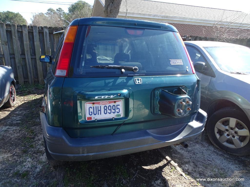 GREEN HONDA CR-V; VIN JHLRD1861009196. 240,811 MILES. THIS CAR WAS ABANDONED AT A HOME DEPOT. NO