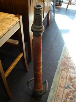 VINTAGE FIRE HOSE NOZZLE; HEAVY BRASS SPOUT AND DOUBLE HANDLES WITH RED WRAPPED HOSE IN CENTER.