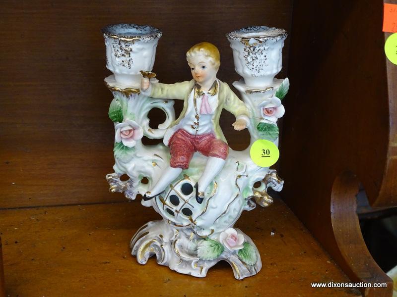 VINTAGE UCAGCO FIGURAL CANDLESTICK; HOLDS UP TO 2 CANDLES AND HAS A FIGURE OF A YOUNG BOY HOLDING A