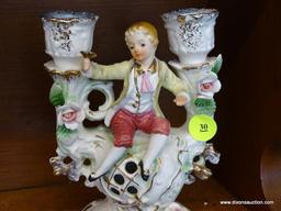 VINTAGE UCAGCO FIGURAL CANDLESTICK; HOLDS UP TO 2 CANDLES AND HAS A FIGURE OF A YOUNG BOY HOLDING A
