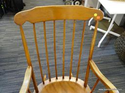 ROCKING CHAIR; MAPLE STRAIGHT BACK AND SPINDLE TURNED LEGGED ROCKING CHAIR. MEASURES 26 IN X 28 IN X