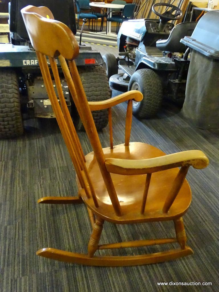ROCKING CHAIR; MAPLE STRAIGHT BACK AND SPINDLE TURNED LEGGED ROCKING CHAIR. MEASURES 26 IN X 28 IN X