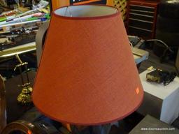 TABLE LAMP; BLACK IN COLOR WITH A RED BELL SHAPED SHADE AND WIRE URN SHAPED BODY. MEASURES 29 IN