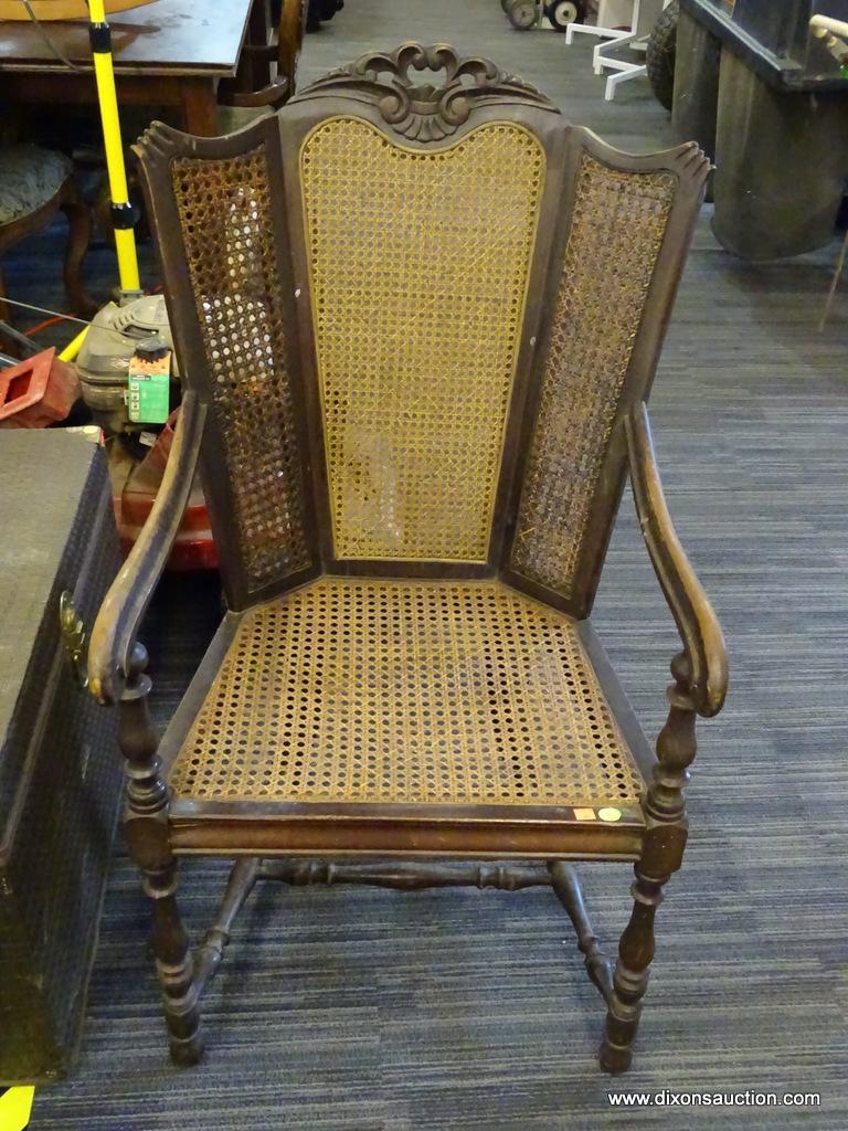 ANTIQUE TRIPLE PANEL CANE WINGBACK CHAIR; WOODEN CARVED FRAME WITH PATTERNED CREST, 3 PANELED BACK