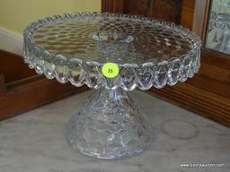 (DR) 2 PIECE GLASS LOT; INCLUDES FOSTORIA AMERICAN CUBIST PATTERNED ROUND GLASS CAKE STAND AS WELL