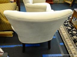 UPHOLSTERED ARM CHAIR; 1 OF A PAIR OF CREAM UPHOLSTERED ARM CHAIRS WITH MAHOGANY LEGS. VERY CLEAN