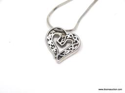 LADIES .925 STERLING SILVER CHAIN & HEART PENDANT. MEASURES 16 IN. LONG. WEIGHS 9 GRAMS.