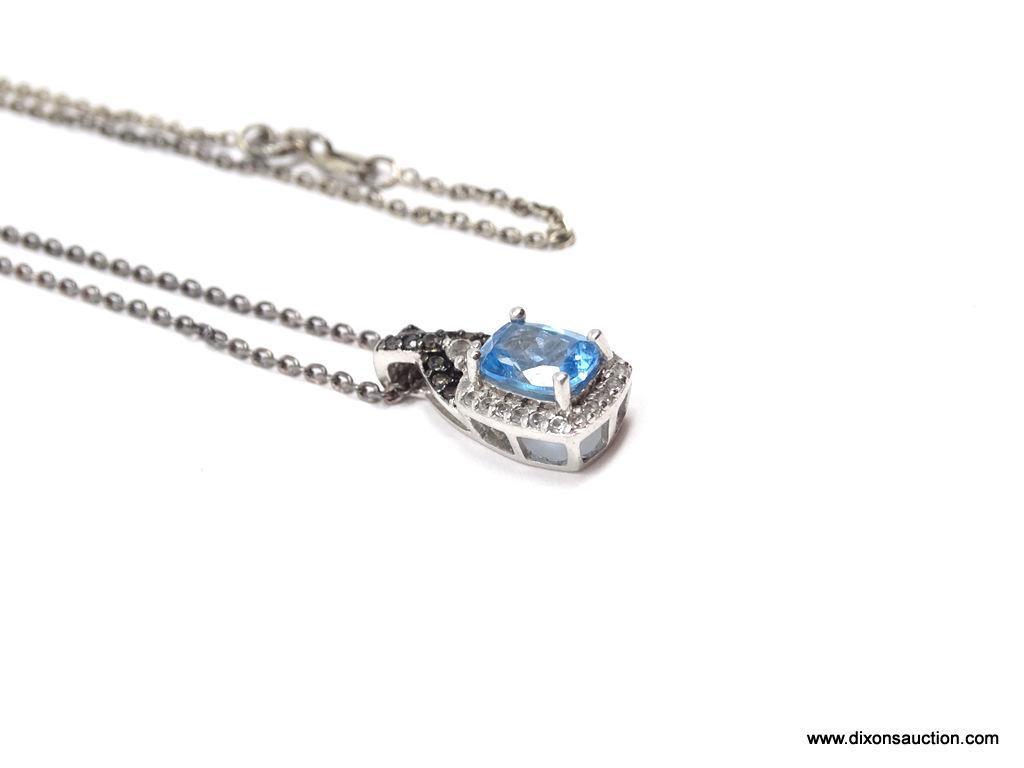 LADIES .925 STERLING SILVER 2-1/2 CT. BLUE TOPAZ PENDANT ON 18 IN. CHAIN. WEIGHS 4.6 GRAMS.