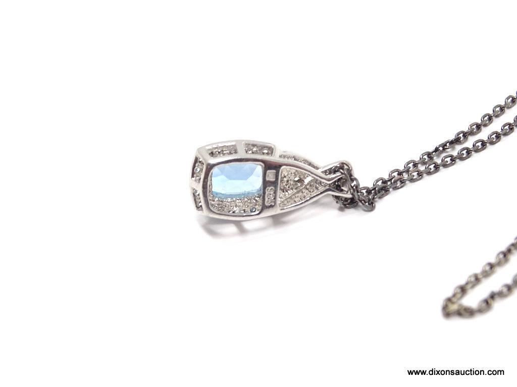 LADIES .925 STERLING SILVER 2-1/2 CT. BLUE TOPAZ PENDANT ON 18 IN. CHAIN. WEIGHS 4.6 GRAMS.