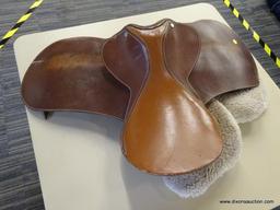 LEATHER 17 IN HORSE SADDLE; COMES WITH A FLEECE SADDLE PAD. IS CARAMEL BROWN IN COLOR.