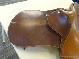 LEATHER 17 IN HORSE SADDLE; COMES WITH A FLEECE SADDLE PAD. IS CARAMEL BROWN IN COLOR.