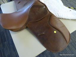 LEATHER 17 IN HORSE SADDLE; COMES WITH A FLEECE SADDLE PAD. IS CARAMEL BROWN IN COLOR.