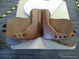 LEATHER 17 IN HORSE SADDLE; COMES WITH A FLEECE SADDLE PAD. IS CARAMEL BROWN IN COLOR.