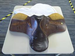 LEATHER 17 IN HORSE SADDLE; COMES WITH A FLEECE SADDLE PAD. IS TWO-TONE BROWN IN COLOR.