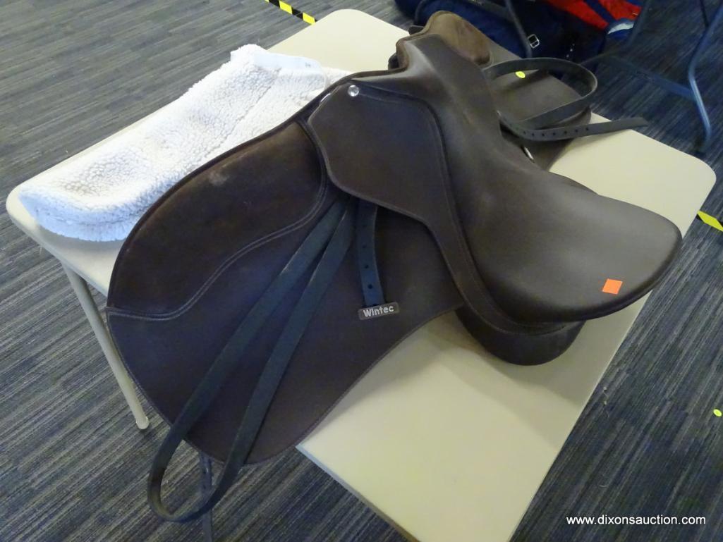 WINTEC 17 IN 500 WIDE LEATHER HORSE SADDLE; IS DARK BROWN IN COLOR. INCLUDES A SADDLE PAD.