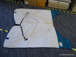 MACINTOSH BRAND HORSE BLANKET; IS GREEN AND BLUE IN COLOR. MEASURES 64 IN.