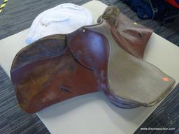 REGENT SADDLER 17 IN LEATHER HORSE SADDLE; IS BROWN IN COLOR AND INCLUDES A SADDLE PAD.