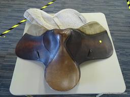 SILVER CUP 17 IN LEATHER HORSE SADDLE; COMES WITH A FLEECE SADDLE PAD. IS BROWN IN COLOR.