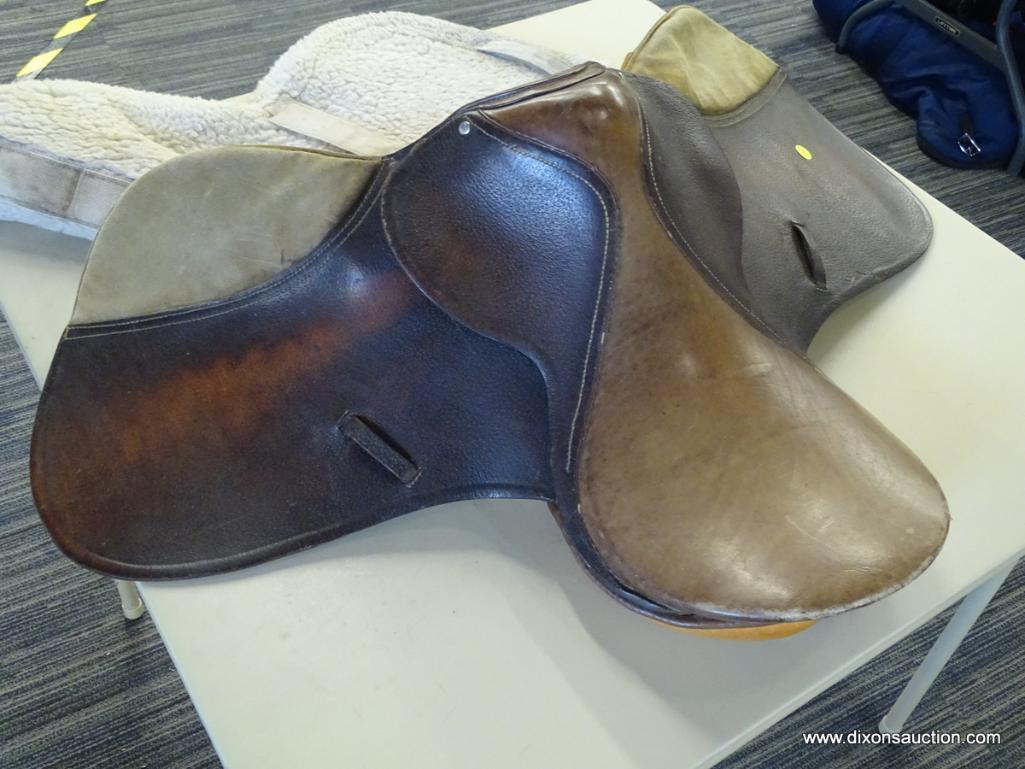 SILVER CUP 17 IN LEATHER HORSE SADDLE; COMES WITH A FLEECE SADDLE PAD. IS BROWN IN COLOR.