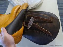 SILVER CUP 17 IN LEATHER HORSE SADDLE; COMES WITH A FLEECE SADDLE PAD. IS BROWN IN COLOR.
