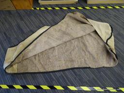 STABLE BLANKET; KHAKI AND BLACK STABLE BLANKET. NEEDS TO BE CLEANED, BUT IN GOOD CONDITION