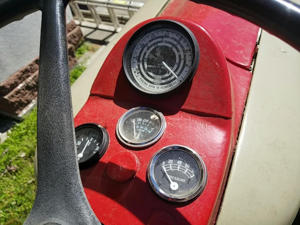 FORD 841 POWERMASTER TRACTOR; FOUR SPEED FORD 2.8L 4-CYCLE GASOLINE ENGINE. RED & WHITE IN COLOR.