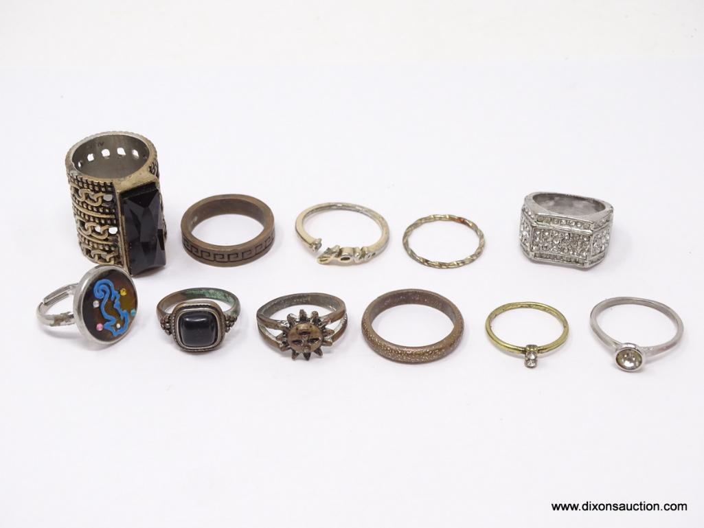 LOT OF ASSORTED COSTUME RINGS; LOT INCLUDES 11 SILVER TONED RINGS. SIZES 5 3/4- 9 1/2.