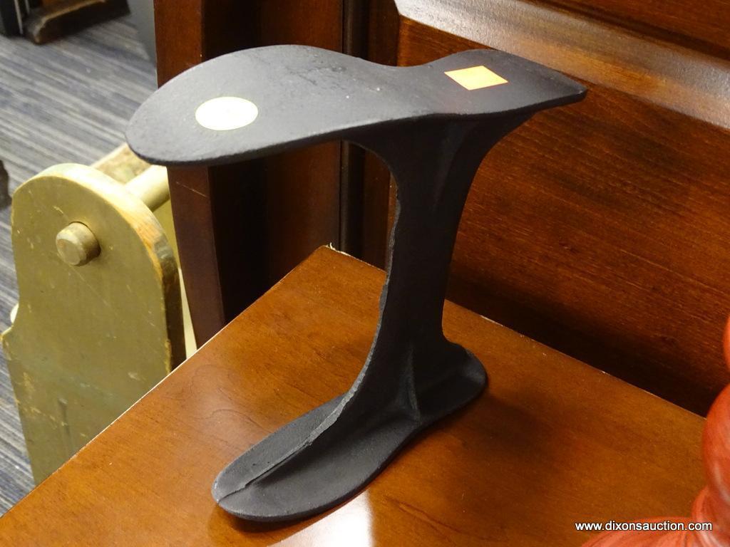 CAST IRON COBBLER SHOE STAND; MARKED "UNBREAKABLE HANDY", BLACK AGED CAST IRON. MEASURES 8 IN TALL.