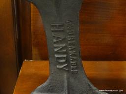 CAST IRON COBBLER SHOE STAND; MARKED "UNBREAKABLE HANDY", BLACK AGED CAST IRON. MEASURES 8 IN TALL.