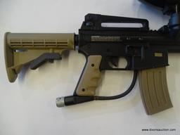 (FRONT) JT TACTICAL PAINTBALL GUN; THIS TAN AND BLACK PAINTBALL GUN INCLUDES A RAISED SIGHT RAIL,