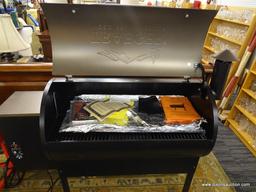 TRAEGER WOOD PELLET GRILL; RESIDENTIAL PELLET GRILL OFFERS 6-IN-1 VERSATILITY TO GRILL, SMOKE, BAKE,