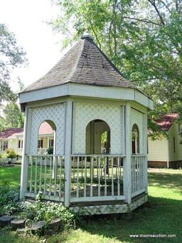 (OUT) GAZEBO; WOODEN OCTAGONAL GAZEBO. MEASURES APPROXIMATELY 11 FT 8 IN X 11 FT 8 IN X 21 FT 8 IN