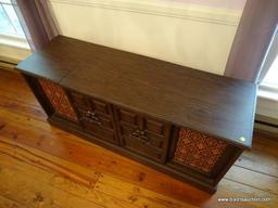 (LR) SEARS STEREO CABINET; HAS AM/FM/TURNTABLE/8-TRACK PLAYING CAPABILITIES. IS IN GOOD WORKING