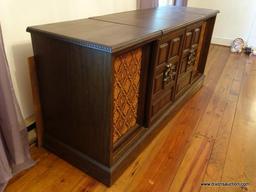 (LR) SEARS STEREO CABINET; HAS AM/FM/TURNTABLE/8-TRACK PLAYING CAPABILITIES. IS IN GOOD WORKING