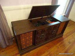 (LR) SEARS STEREO CABINET; HAS AM/FM/TURNTABLE/8-TRACK PLAYING CAPABILITIES. IS IN GOOD WORKING