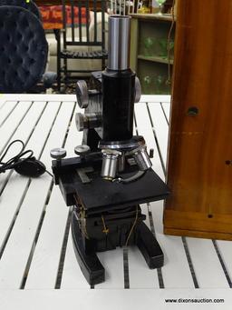 VINTAGE ELECTRIC BAUSCH & LOMB MICROSCOPE; BLACK VINTAGE MICROSCOPE MADE BY BAUSCH & LOMB. MODEL NO.