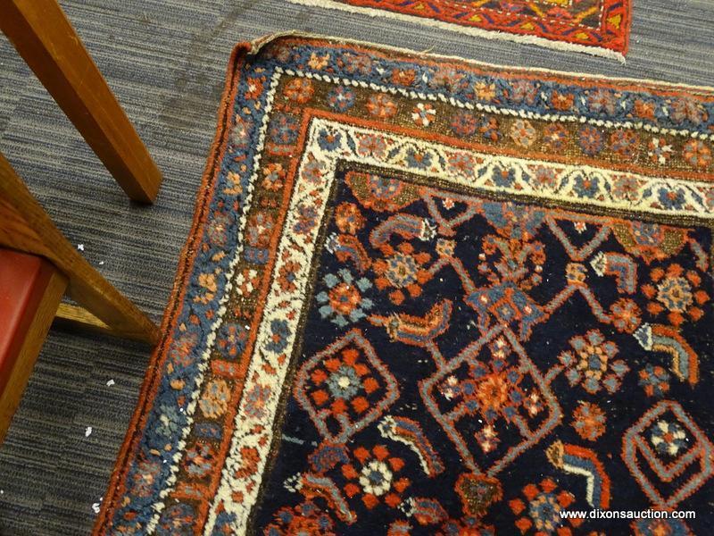 HAND KNOTTED ORIENTAL AREA RUG; BEAUTIFUL RUG IN HUES OF BLUE, RED, AND CREAM WITH A FLORAL PATTERN.