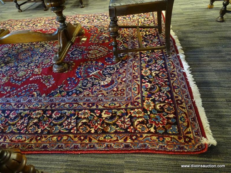 GENUINE HAND KNOTTED ORIENTAL RUG; 100% WOOL HAND KNOTTED MASHAD RUG. RED FIELD COLOR WITH A NAVY